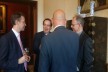 Attendees enjoy drinks after the lecture