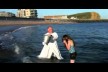 Graham Kings, as Bishop of Sherborne, baptising young people in the sea at West Bay, Bridport, Dorset, after a weeks mission in 2011. Filmed by Michael Ford.