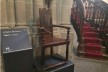 Jean Calvin's chair in St Peter's Cathedral, Geneva, with stairs to pulpit in background